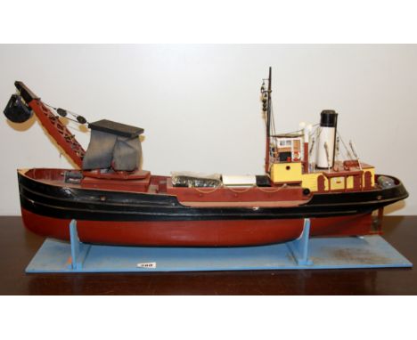 A large motorised wooden model ship, L. 84cm.