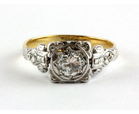 A yellow and white metal (tested 18ct gold) brilliant cut diamond set solitaire ring, approx. 0.50ct, (N.5).