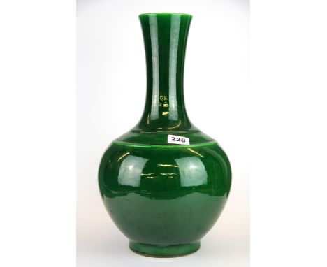 A Chinese green glazed porcelain vase with six character mark to base, Kangxi (1662 - 1722) but probably later, H. 42cm.