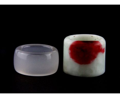 A Chinese mixed colour soapstone archer's ring and a chalcedony archer's ring.
