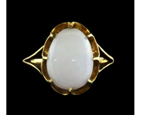 An 18ct yellow gold (stamped 18ct) ring set with a cabochon cut opal (G.5).