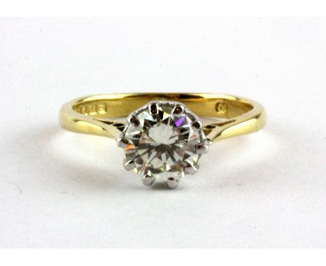 An 18ct yellow gold solitaire ring set with a 1.04ct brilliant cut diamond, clarity VS2, colour K, with a W.G.I. certificate,