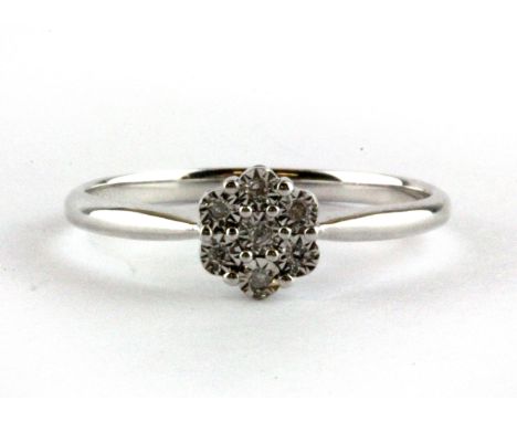 A 9ct white gold diamond set cluster ring, (L.5).