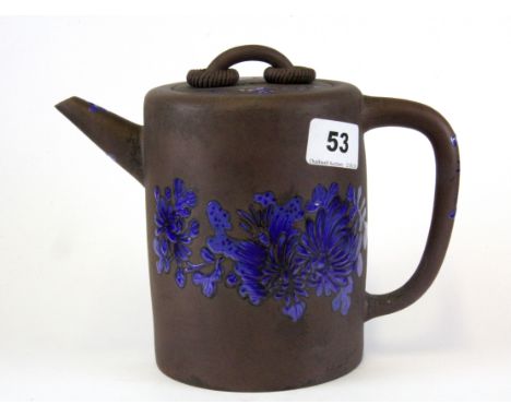 An unusual Chinese Yixing terracotta teapot with loose rings to the lid, H. 17cm.