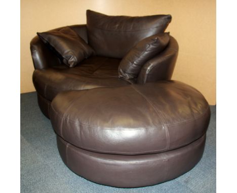 A large Contemporary circular leather revolving chair and half moon foot stool, Dia. 130cm.