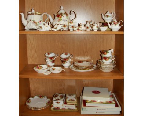 A quantity of Royal Albert ''Old Country Roses'' tea china and miniature tea china. (first quality)