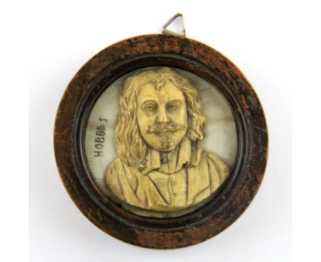 A 19th Century framed carved ivory portrait miniature of a gentleman, Dia. 7cm.