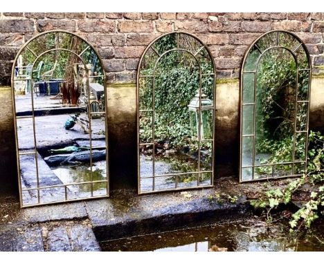 ARCHITECTURAL GARDEN WALL MIRRORS, a set of three, bronzed arch top frames, 107cm x 56cm. (3) 