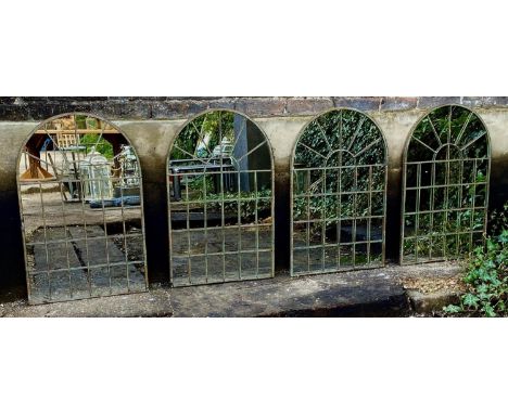 ARCHITECTURAL GARDEN MIRRORS, a set of four, aged metal frames, 78cm x 49cm. (4) 