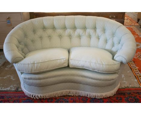 SOFA, kidney form with two seat cushions in patterned pale green material, 157cm W. 