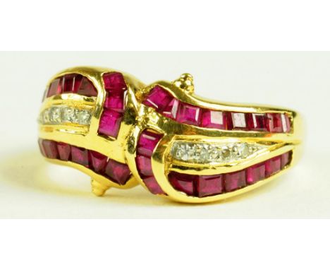 A RUBY AND DIAMOND CROSSOVER RING, WITH LINES OF DIAMONDS FLANKED BY CALIBRE CUT RUBIES IN GOLD, MARKED 750, 4.9G
