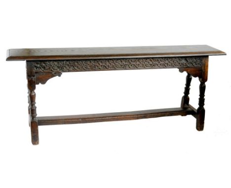 AN OAK LONG STOOL, 17TH C AND LATER  height 57cm; 29 x 150cm 