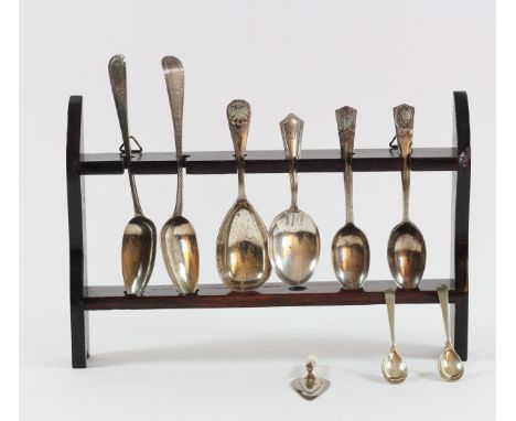 A silver caddy spoon, Sheffield 1918 with shell terminal, a pair of George III bright cut tea spoons, a silver page trowel, B