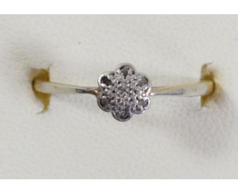 An 18ct gold diamond cluster ring, set with rose cuts, N, 1.7gm 