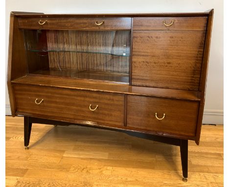A Circa 1960's E. Gomme Librenza Tola Wood sideboard by G. Plan, of sloped form with frieze drawer over a cupboard with two s
