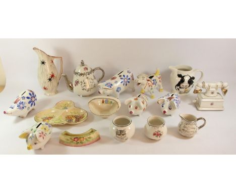 A collection of mid 20th Century and later Arthur Wood pottery pieces to include novelty "Piggy Banks", condiment sets, three