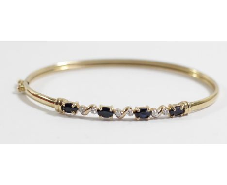A 9ct gold sapphire and diamond bangle, 4.3gm 