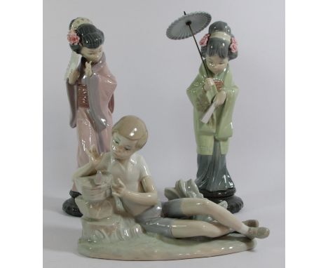 A pair of Lladro ceramic figurines of Geisha girls 30cm tall, together with a Lladro model of a seated boy with bird 16cm tal