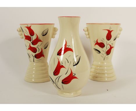 A pair of mid 20th century Arthur Wood Art Deco ceramic vases of cylindrical shape decorated with hand painted tulips, togeth