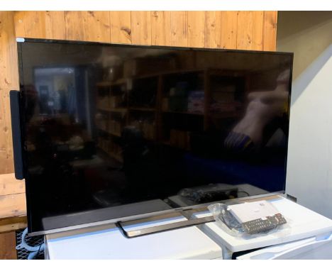 A Panasonic (model TX-55CS520B) 55inch TV, remote, AV and power cables, together with a Q Acoustic (Q-TV2X) rear mounted spea