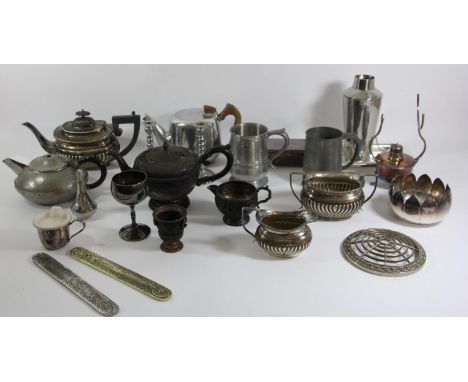 A collection of plated wares to include a coffee service, pewter tea service, cigarette box, platters, serving dishes, candle