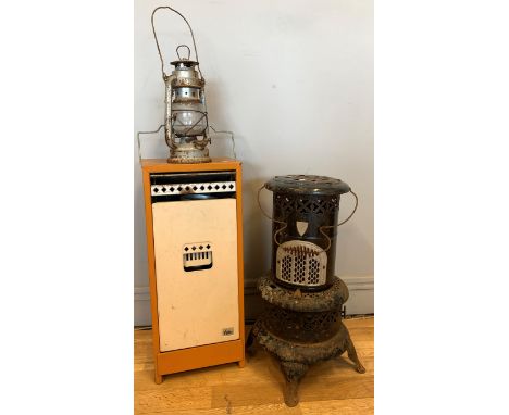 A Valor paraffin heater, 56m tall, together with another Valor 106-R paraffin heater, together with a Tilley lamp (3)