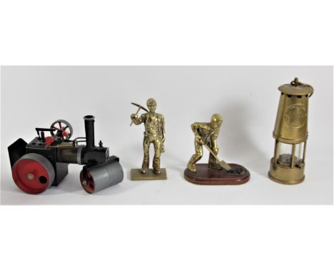 A Mamod model of a live steam traction engine, together with a Eccles miners lamp and two brass figures of coal miners. (4) 