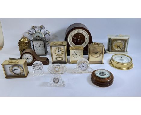 A collection of mid 20th Century mantle clocks and barometers to include Smiths Bakelite, Swiza 8 day mantle, an Elliott 8 da