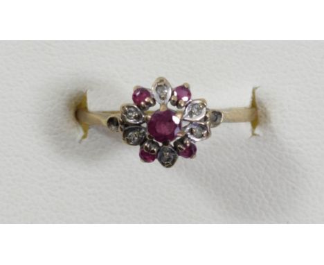 A 9ct gold ruby and diamond cluster ring, L 1/2, 1.3gm 