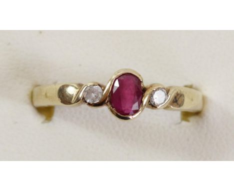 A 9ct gold ruby and diamond three stone ring, S, 3.1gm 