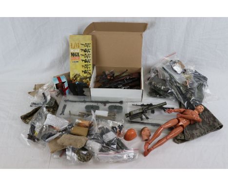 A collection of Dragon 1/6th scale action figure accessories to include uniforms, guns, field gear, spare heads and bodies. 