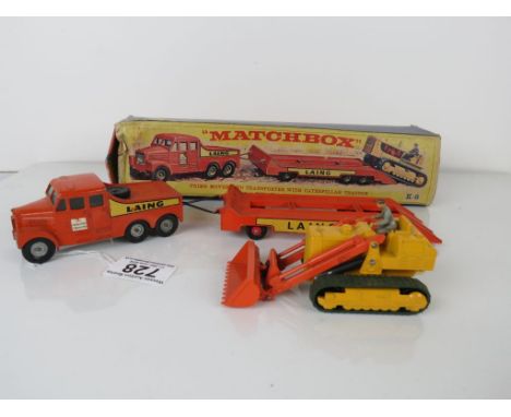 Boxed Matchbox Lesney K-8 Prime Mover and Transporter with Caterpillar Tractor. Diecast gd with very minor paint loss. Box fa