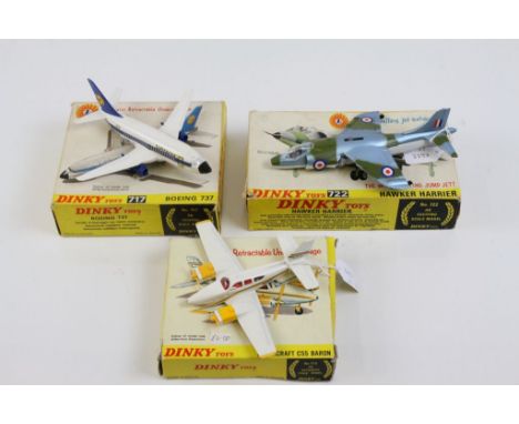 Three boxed Dinky model planes to include 722 Hawker Harrier, 717 Boeing 737 with inner packaging and paperwork and 715 Beech