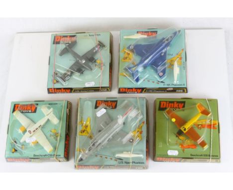 Five boxed Dinky diecast model planes to include 715 Beechcraft C55 Baron, 710 Beechcraft S35 Bonanza, 730 US Navy Phantom, 7