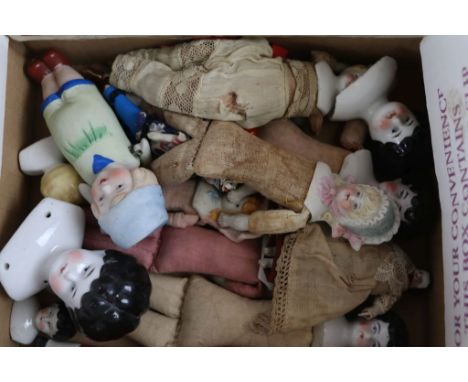 Collection of Ten China shoulder and head Dolls, mainly German with straw filled bodies in varying sizes up to approx 21cm lo