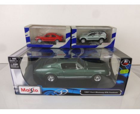 Boxed Maisto Special Edition 1967 Ford Mustang GTA Fastback model plus 2 boxed Pauls Model Art Volvo vehicles featuring S60 7