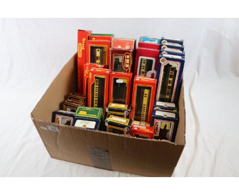 35 Boxed items of OO gauge model railway rolling stock featuring coaches and wagons to include Triang 14, Bachmann x 9, Dapol