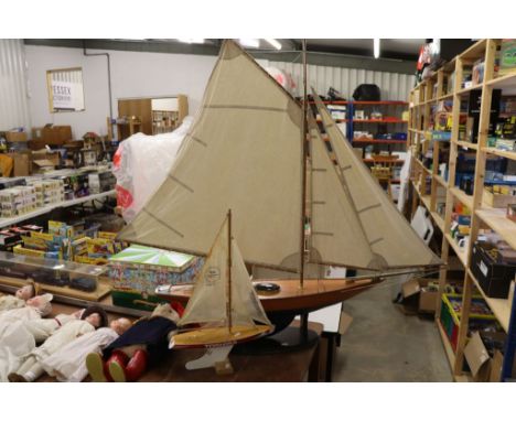 Large mid 20th C wooden pond yacht, on stand, in vg condition, 47" in approx length and sails 37" in approx height, plus anot