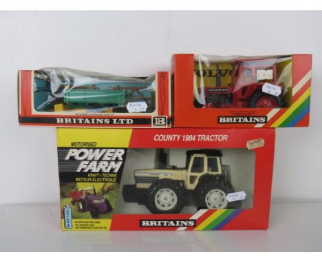 Boxed Britains 9324 Motorised Power Farm County 1884 Tractor in vg condition plus a boxed 9521 Volvo Tractor and 9565 Tipping