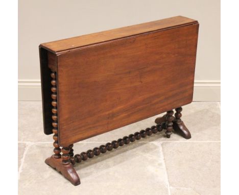 A Victorian mahogany Sutherland table, the rectangular drop leaf top with rounded corners raised upon bobbin turned supports 