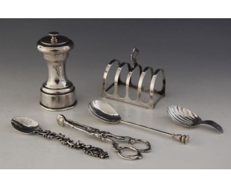 A selection of silver tableware, to include; a George V silver four-division toast rack, Reid & Sons, Birmingham 1936, 7.5cm 