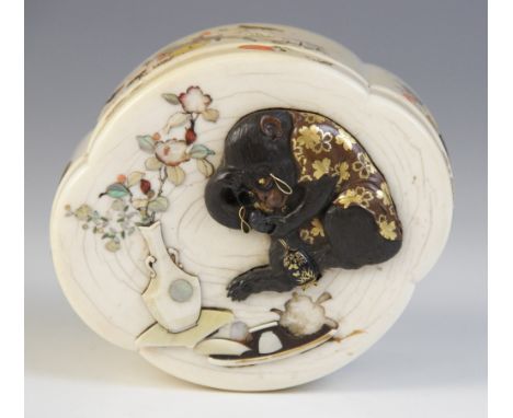 A Japanese shibayama box and cover, Meiji Period (1868-1912), the quatrefoil shaped box inlaid with mother of pearl, abalone,