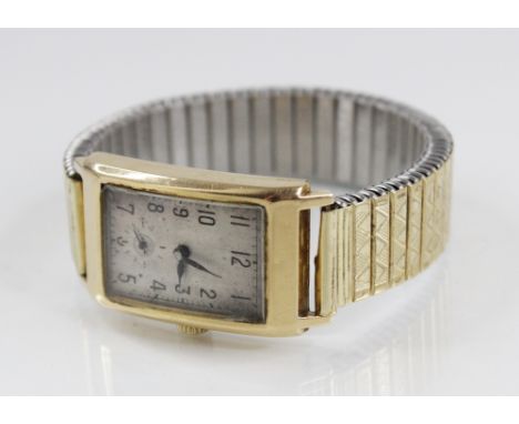 A Gentleman's vintage 18ct gold Buren Grand Prix wristwatch, the rectangular silver brushed dial with arabic numerals and sub