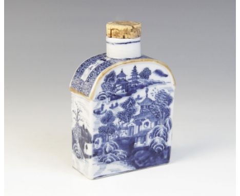 A Chinese porcelain blue and white tea caddy, Qianlong (1736-1795), of arched rectangular form decorated with scenes of pagod