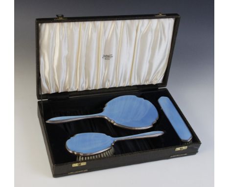 A silver and enamelled dressing table set, Adie Brothers, Birmingham 1939, comprising mirror, clothes brush and hairbrush, ea