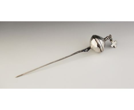 A 19th century Bolivian Mapuche cloak pin, the pin proper surmounted by an with engraved decoration, suspending a cross penda