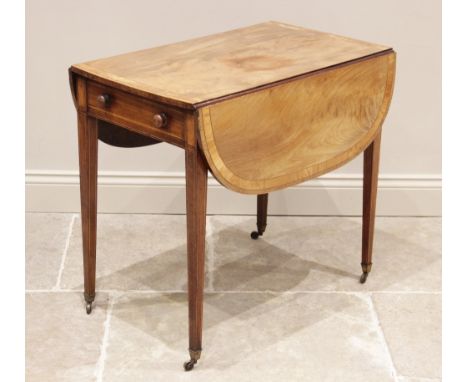 A Regency mahogany and satinwood crossbanded Pembroke table, the rectangular top with rounded leaves above an oak lined friez