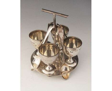 A George V silver egg cruet, Mappin & Webb, Sheffield 1911, comprising four cups, each 6.2cm high, set to a circular stand ra