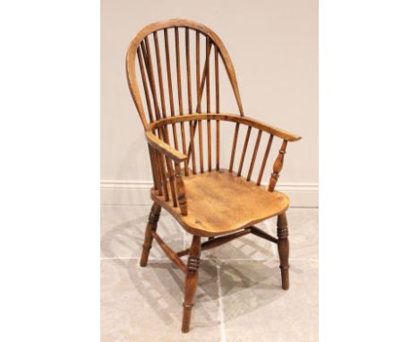 A 19th century ash, elm and beech wood Windsor farmhouse elbow chair, stamped 'J W Webb', the hooped back above a shaped elm 