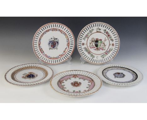 Five Chinese export armorial porcelain plates, 20th century, each of circular form with pierced borders, each decorated in po